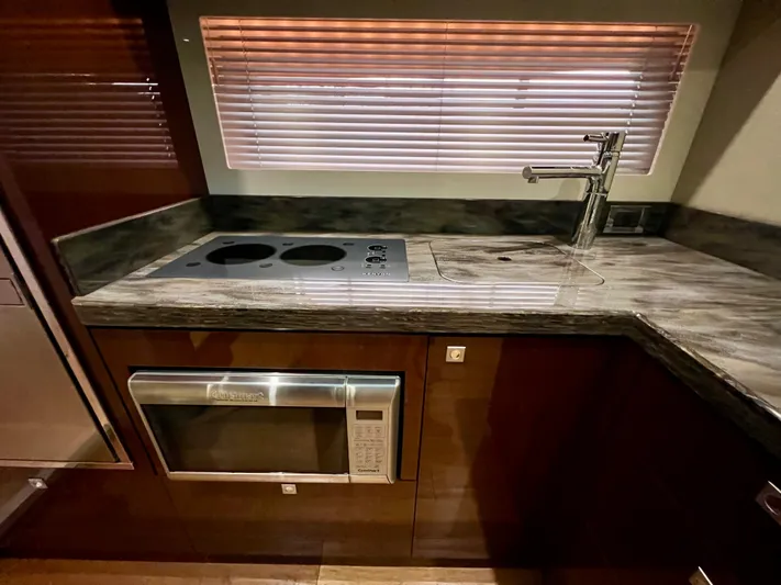  Yacht Photos Pics Luxurious kitchen area in 2014 Sea Ray 410 Sundancer yacht with modern appliances.