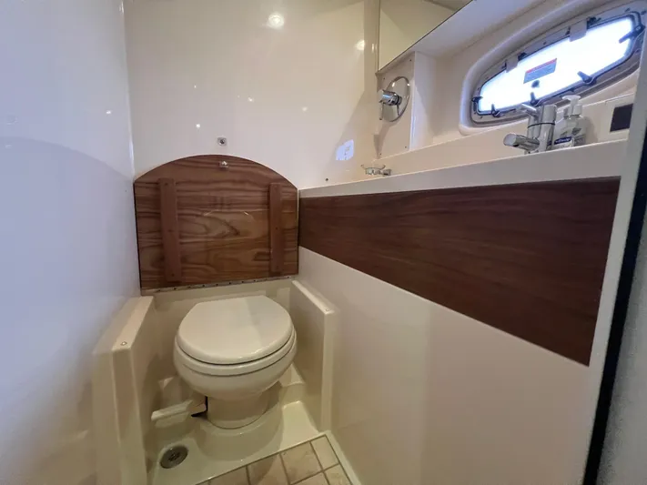  Yacht Photos Pics Bathroom interior of 2014 Sea Ray 410 Sundancer yacht, featuring a compact toilet.