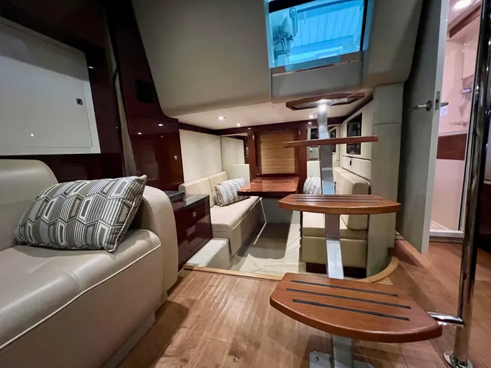  Yacht Photos Pics Luxurious interior of 2014 Sea Ray 410 Sundancer yacht with modern seating and wooden accents.