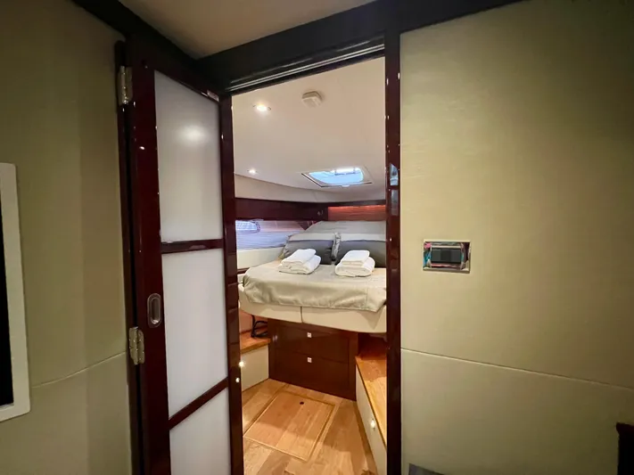  Yacht Photos Pics Luxurious cabin interior of 2014 Sea Ray 410 Sundancer yacht with bed and skylight.