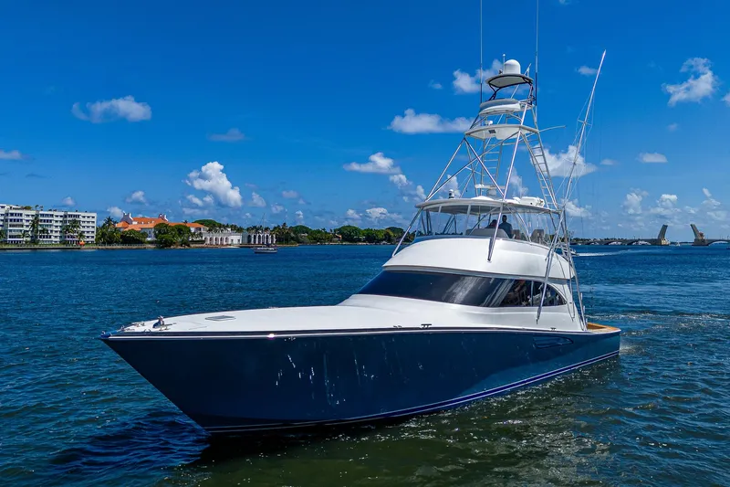 Gypsea Yacht Photos Pics 2015 Viking 66 Open yacht cruising on a sunny day with blue skies.