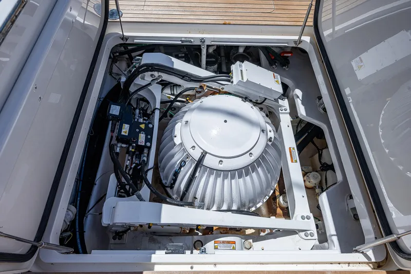 Gypsea Yacht Photos Pics Engine compartment of a 2015 Viking 66 Open yacht, showcasing mechanical components.