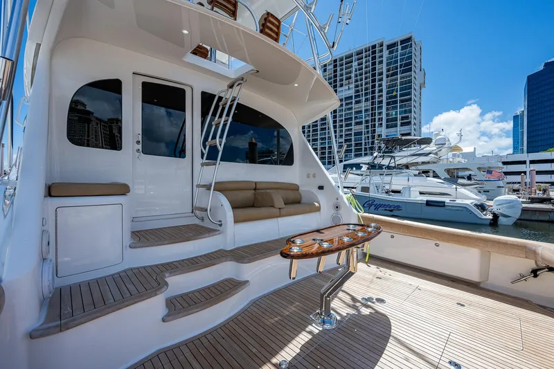 Gypsea Yacht Photos Pics 2015 Viking 66 Open yacht with spacious deck and luxurious seating in marina.