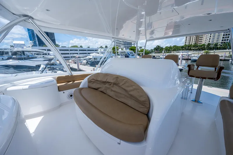 Gypsea Yacht Photos Pics 2015 Viking 66 Open yacht interior with seating, docked at marina.