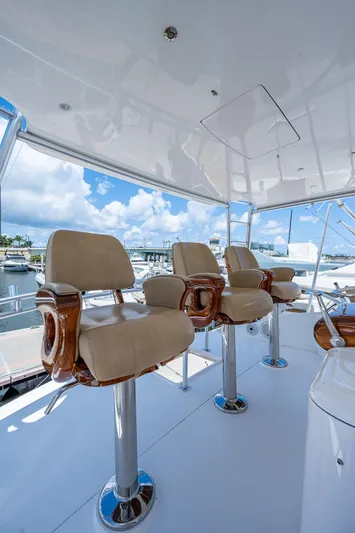 Gypsea Yacht Photos Pics Luxurious seating on 2015 Viking 66 Open yacht with marina view.