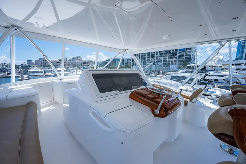 Gypsea Yacht Photos Pics Luxurious 2015 Viking 66 Open yacht helm with modern controls and panoramic marina view.