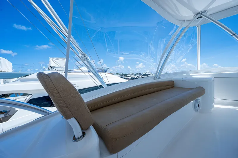 Gypsea Yacht Photos Pics Luxurious seating on a 2015 Viking 66 Open yacht under a clear blue sky.