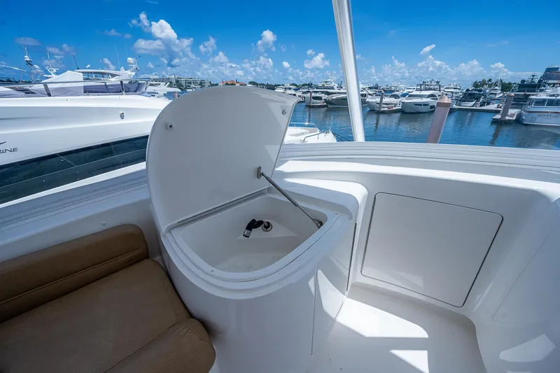 Gypsea Yacht Photos Pics 2015 Viking 66 Open yacht with open hatch, docked in a marina under clear skies.