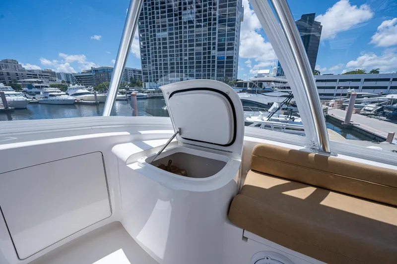 Gypsea Yacht Photos Pics 2015 Viking 66 Open yacht interior with open storage compartment, docked in marina.