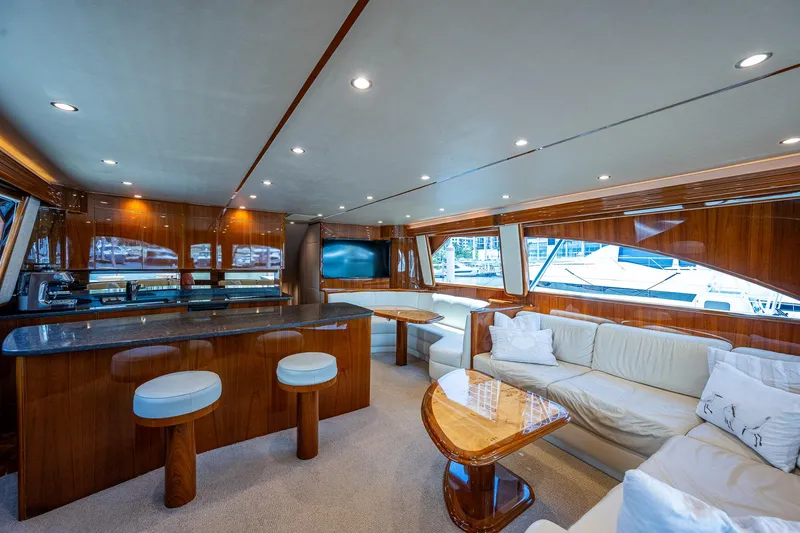 Gypsea Yacht Photos Pics Luxurious interior of 2015 Viking 66 Open yacht with elegant wood finishes and plush seating.