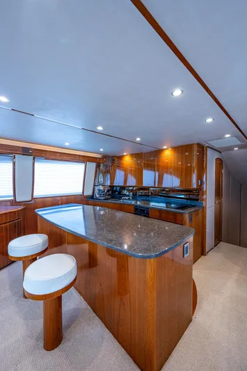 Gypsea Yacht Photos Pics Luxurious interior of 2015 Viking 66 Open yacht with modern kitchen and seating.
