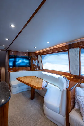 Gypsea Yacht Photos Pics Luxurious interior of 2015 Viking 66 Open yacht with elegant seating and wood finishes.