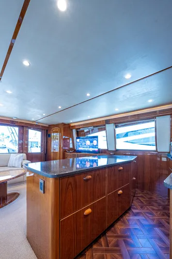 Gypsea Yacht Photos Pics Luxurious interior of 2015 Viking 66 Open yacht with elegant wood finishes and modern lighting.