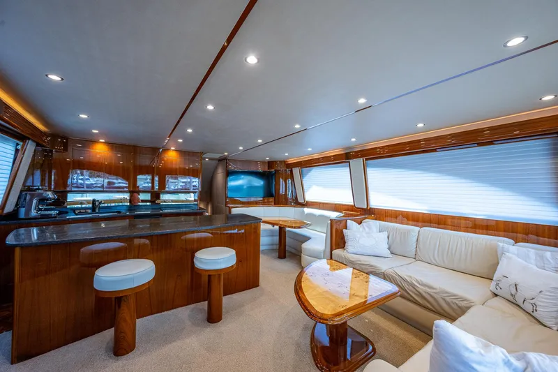 Gypsea Yacht Photos Pics Luxurious interior of 2015 Viking 66 Open yacht with elegant seating and wooden finishes.