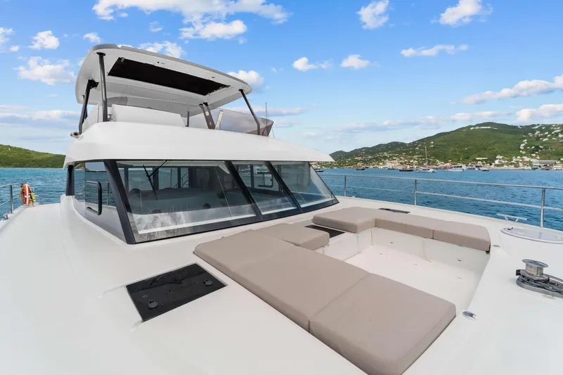 Mona Lisa Yacht Photos Pics 2024 Fountaine Pajot MY.6 yacht with spacious deck, scenic ocean view, and modern design.