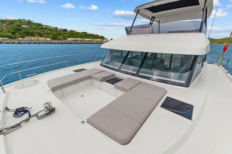 Mona Lisa Yacht Photos Pics 2024 Fountaine Pajot MY.6 yacht with spacious deck and scenic ocean view.