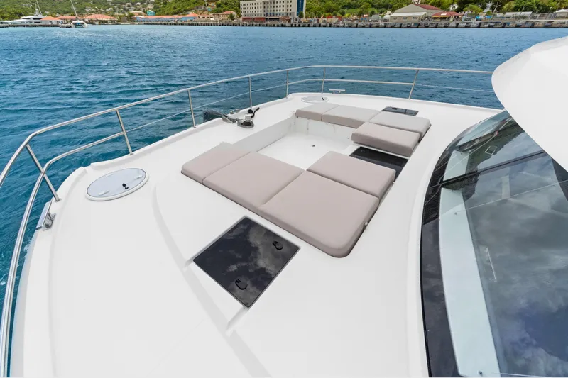 Mona Lisa Yacht Photos Pics 2024 Fountaine Pajot MY.6 yacht with spacious sunbathing deck on calm waters.