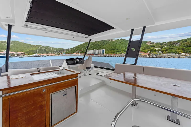 Mona Lisa Yacht Photos Pics Luxurious 2024 Fountaine Pajot MY.6 yacht interior with scenic ocean view.