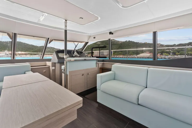 Mona Lisa Yacht Photos Pics 2024 Fountaine Pajot MY.6 yacht interior with modern seating and panoramic windows.