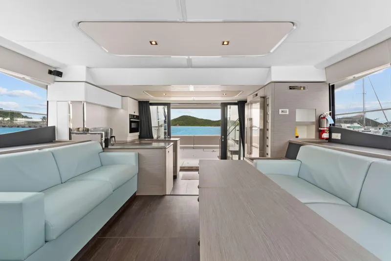 Mona Lisa Yacht Photos Pics Luxurious interior of 2024 Fountaine Pajot MY.6 yacht with modern seating and ocean view.