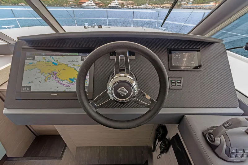 Mona Lisa Yacht Photos Pics 2024 Fountaine Pajot MY.6 helm with navigation screens and steering wheel.