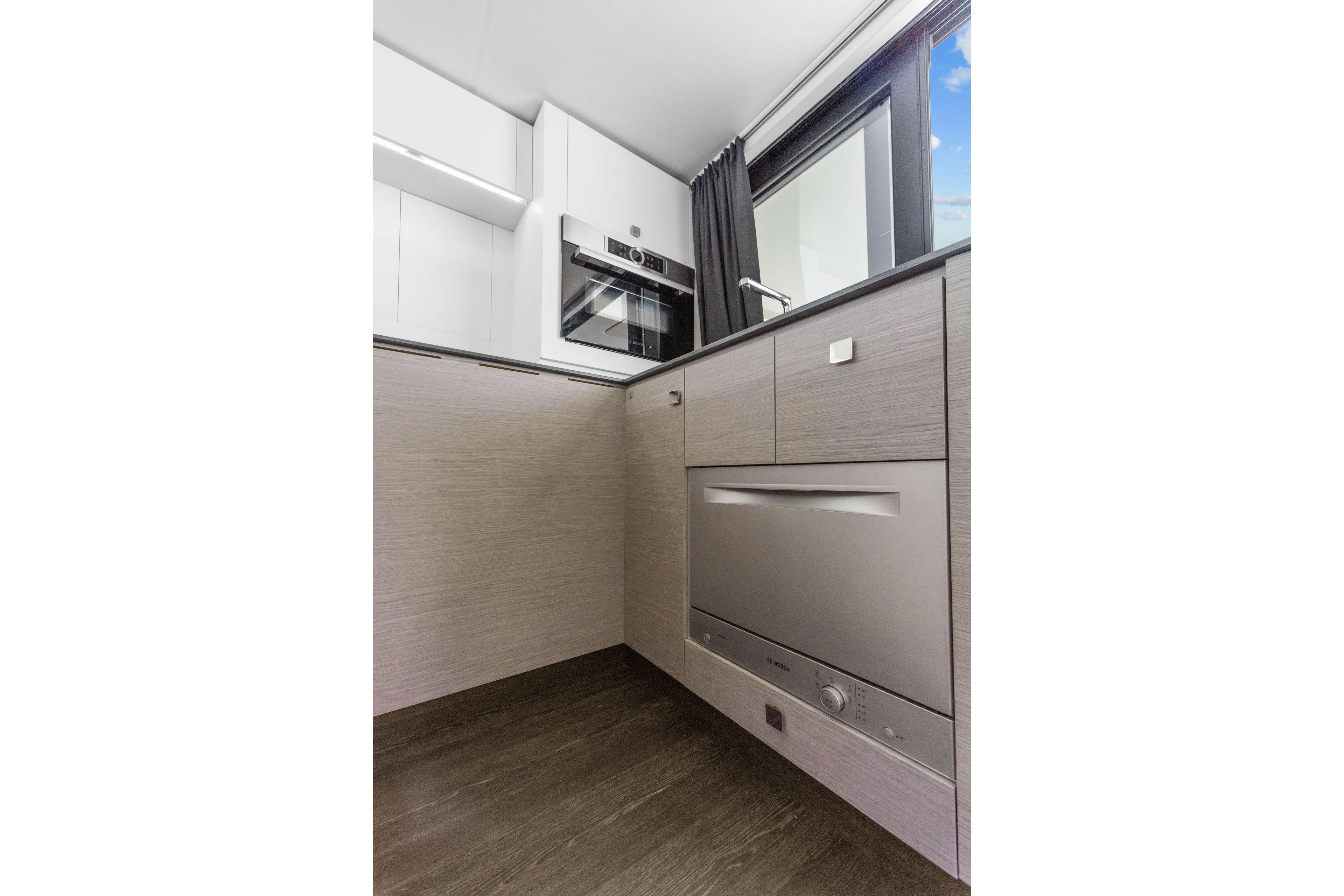 Mona Lisa Yacht Photos Pics Modern kitchen interior on 2024 Fountaine Pajot MY.6 yacht, featuring sleek cabinetry and appliances.