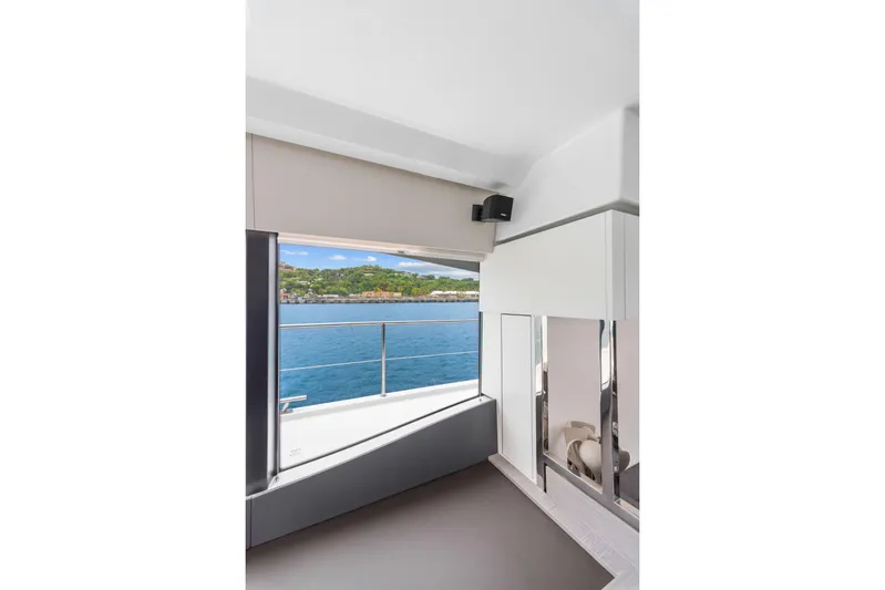 Mona Lisa Yacht Photos Pics Interior view of 2024 Fountaine Pajot MY.6 yacht with ocean and island scenery.