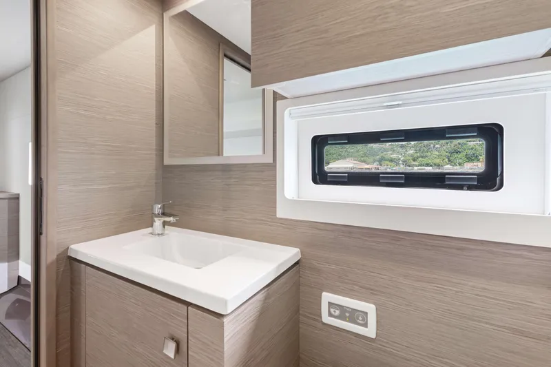 Mona Lisa Yacht Photos Pics Modern bathroom interior of 2024 Fountaine Pajot MY.6 yacht with sleek design.