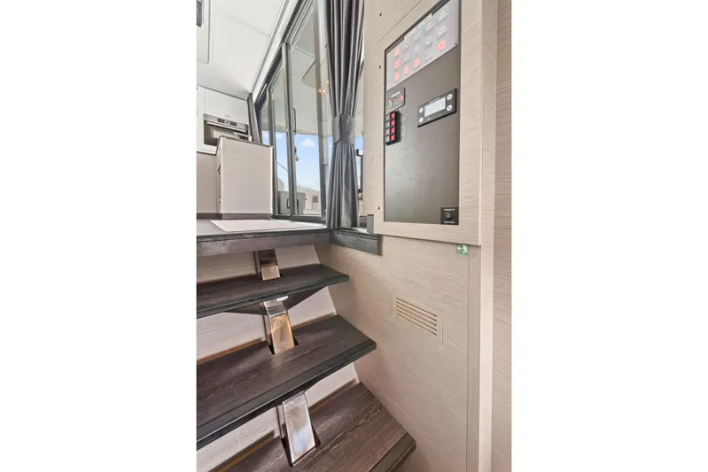 Mona Lisa Yacht Photos Pics Interior stairs and control panel of 2024 Fountaine Pajot MY.6 yacht.