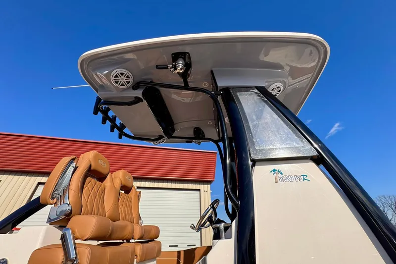  Yacht Photos Pics 2026 Key West 239 FSR boat with tan seats and T-top against blue sky.