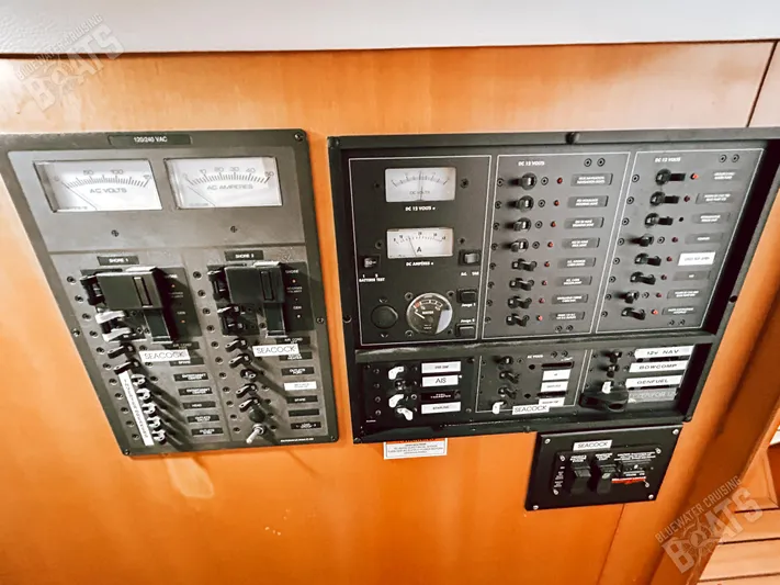 Kansakota Winds Yacht Photos Pics Electrical control panel on a 2003 Lagoon 410-S2 yacht, featuring various switches and gauges.