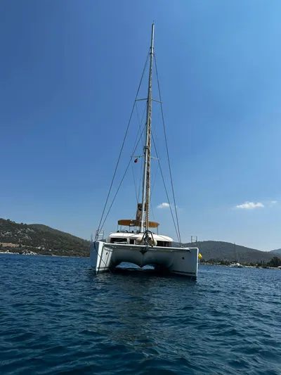  Yacht Photos Pics 2012 Lagoon 620 catamaran on calm blue water under clear sky.