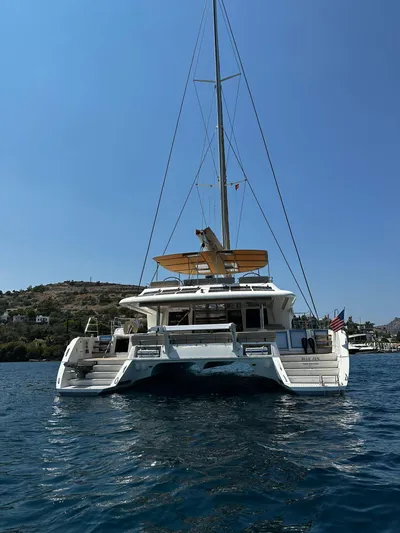  Yacht Photos Pics 2012 Lagoon 620 catamaran on water, sunny day, scenic background.