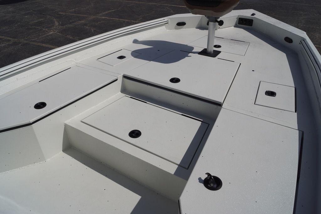 2026 Excel 230 Bay Pro Elite boat deck with storage compartments.