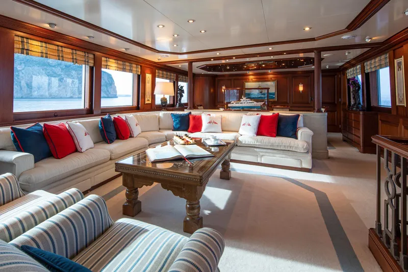 Monaco Yacht Photos Pics Luxurious 1982 Feadship Classic yacht interior with elegant seating and ocean views.