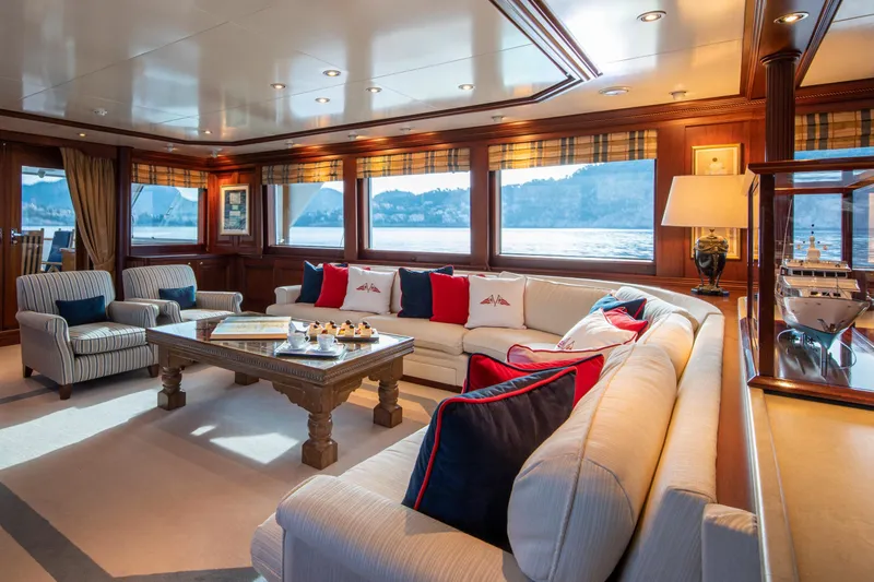 Monaco Yacht Photos Pics Luxurious interior of 1982 Feadship Classic yacht with elegant seating and scenic views.