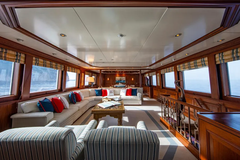Monaco Yacht Photos Pics Luxurious interior of 1982 Feadship Classic yacht with elegant seating and ocean views.