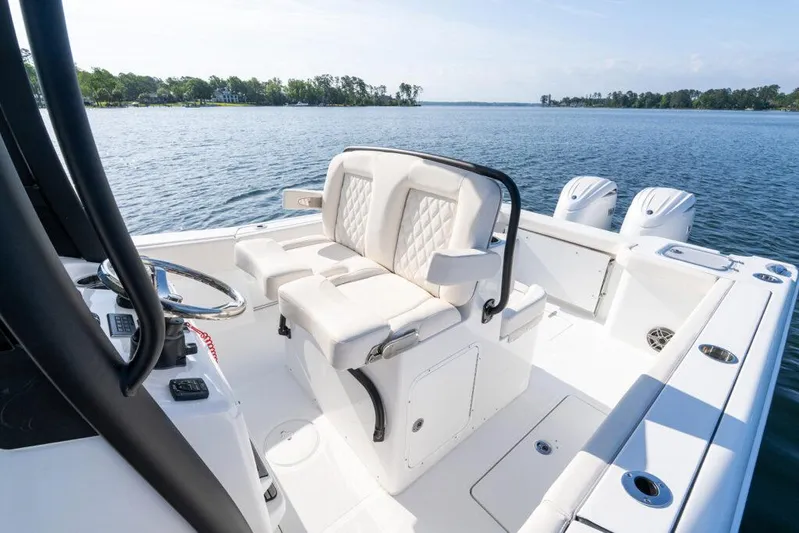  Yacht Photos Pics Manufacturer Provided Image: 2025 Sea Hunt Gamefish 27 Coffin Box boat interior with dual seats and steering wheel.