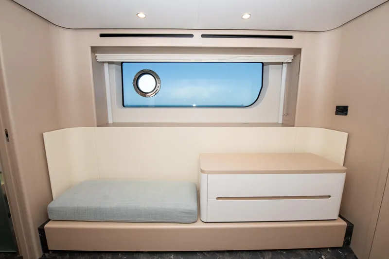 Crimson Yacht Photos Pics Interior of 2023 Azimut Fly 68 yacht with modern seating and window view.