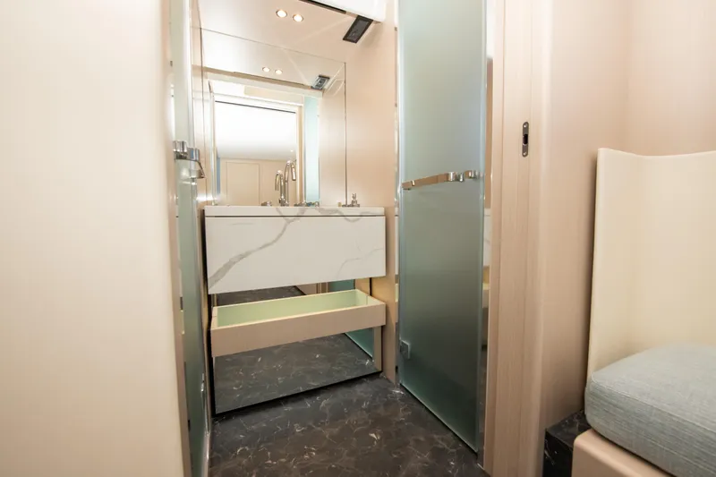 Crimson Yacht Photos Pics Luxurious bathroom interior of 2023 Azimut Fly 68 yacht with modern fixtures.