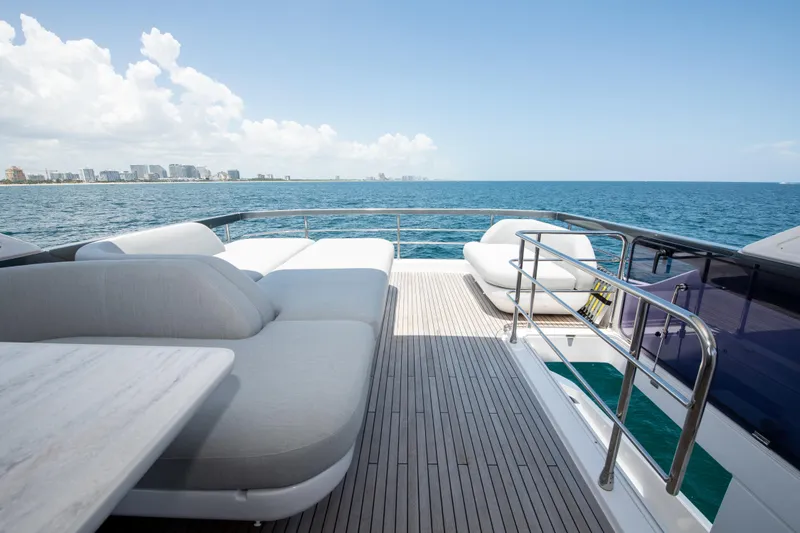 Crimson Yacht Photos Pics Luxurious 2023 Azimut Fly 68 yacht deck with ocean view and comfortable seating.