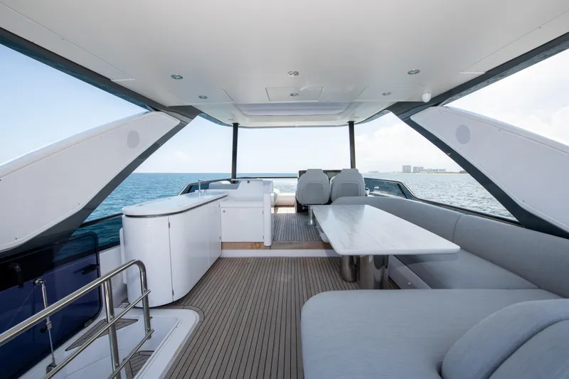 Crimson Yacht Photos Pics Luxurious 2023 Azimut Fly 68 yacht interior with elegant seating and ocean view.