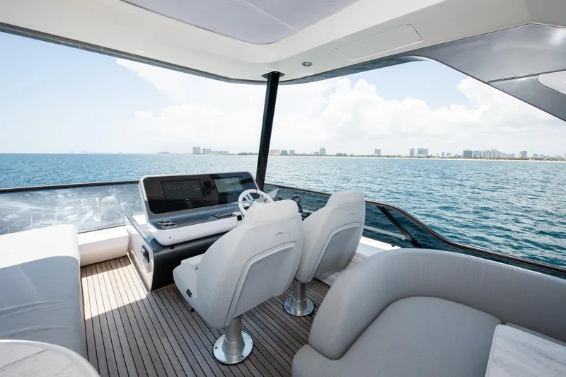 Crimson Yacht Photos Pics Luxurious 2023 Azimut Fly 68 yacht interior with ocean view and modern helm.