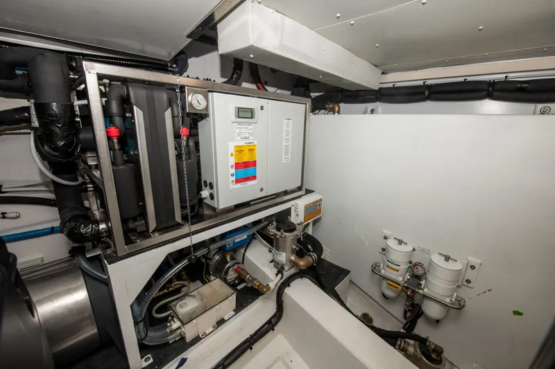 Crimson Yacht Photos Pics Engine room of 2023 Azimut Fly 68 yacht, showcasing advanced machinery and equipment.