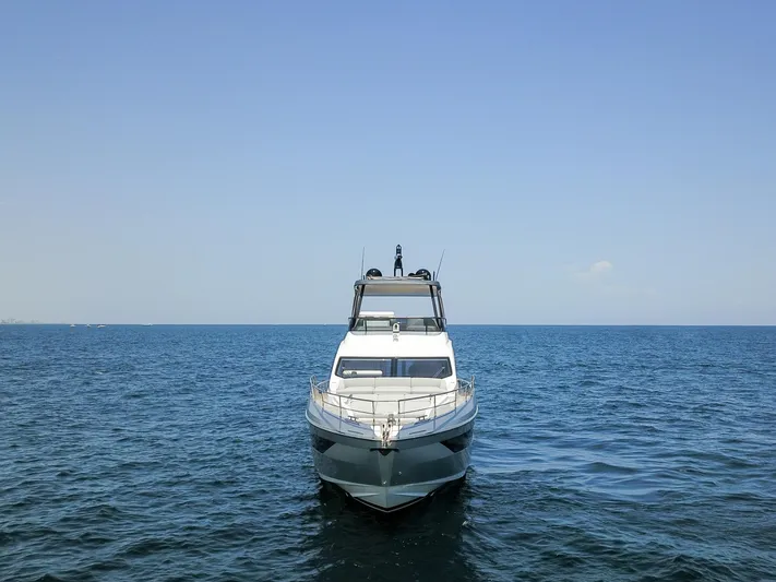 Crimson Yacht Photos Pics 2023 Azimut Fly 68 yacht on open sea, front view.