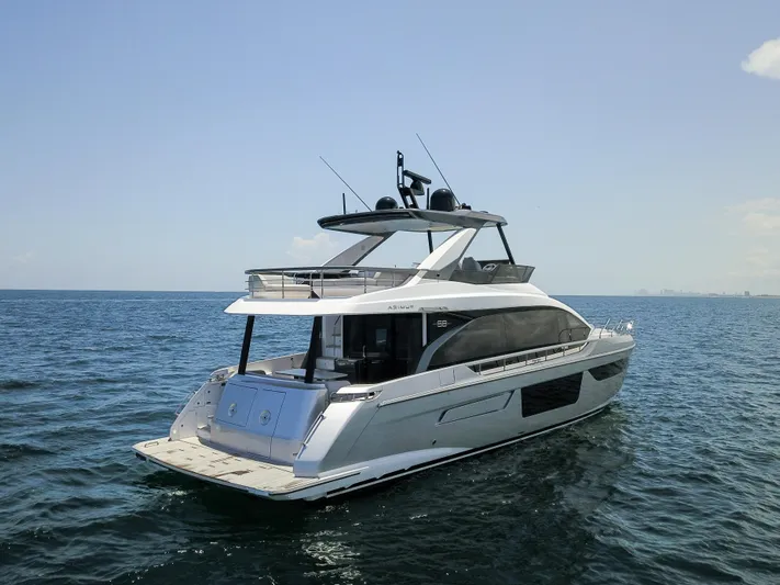 Crimson Yacht Photos Pics 2023 Azimut Fly 68 yacht cruising on open water.