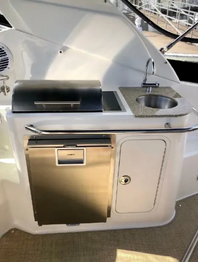  Yacht Photos Pics 2017 Sea Ray Sundancer 280 boat kitchenette with grill, sink, and storage.