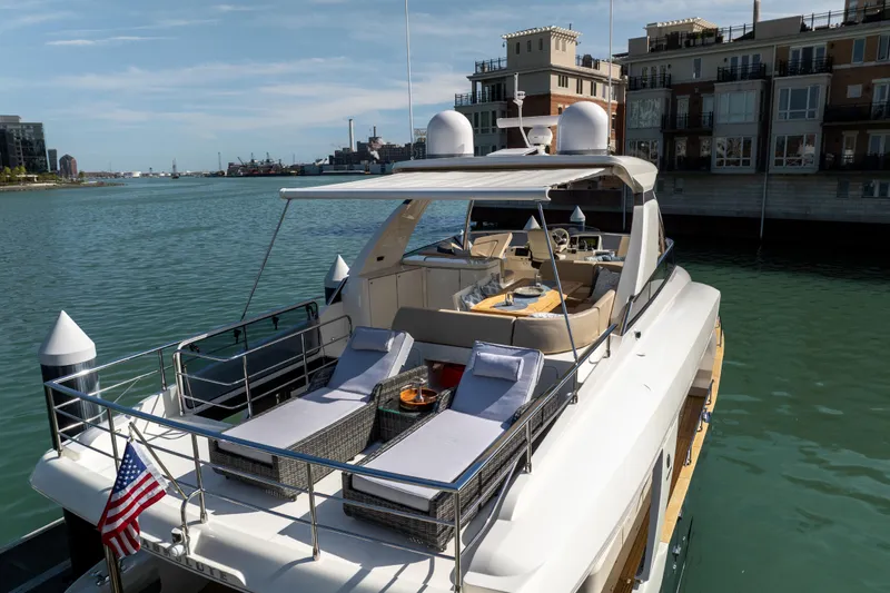 Forever Young Yacht Photos Pics Luxury 2018 Absolute 58 Navetta yacht docked, featuring spacious deck and elegant design.