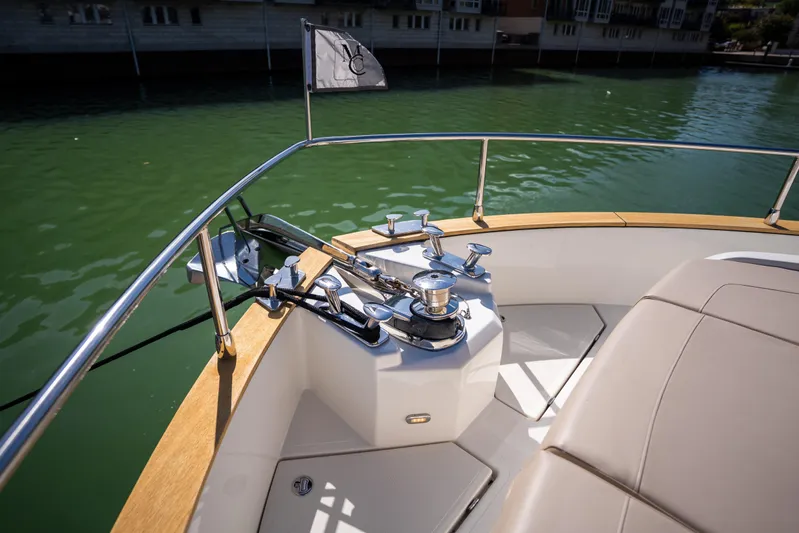 Forever Young Yacht Photos Pics Bow area of 2018 Absolute 58 Navetta yacht with anchor and seating.