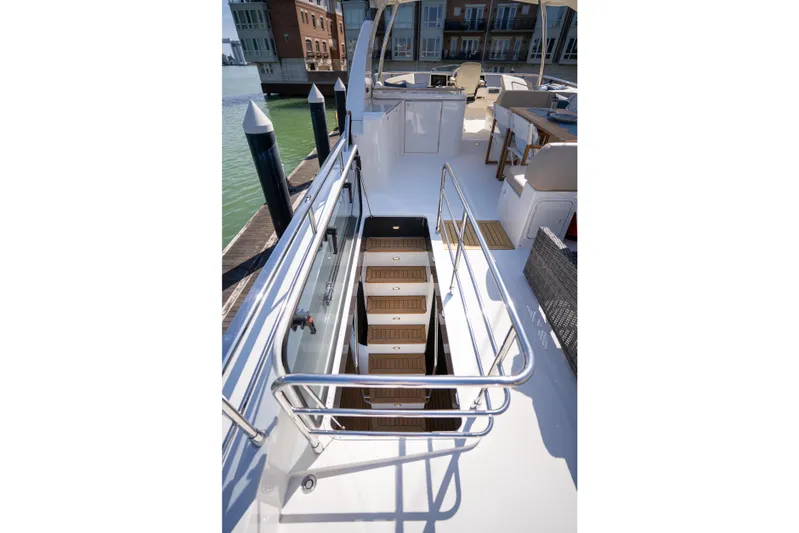 Forever Young Yacht Photos Pics Staircase on 2018 Absolute 58 Navetta yacht deck, featuring sleek design and modern amenities.